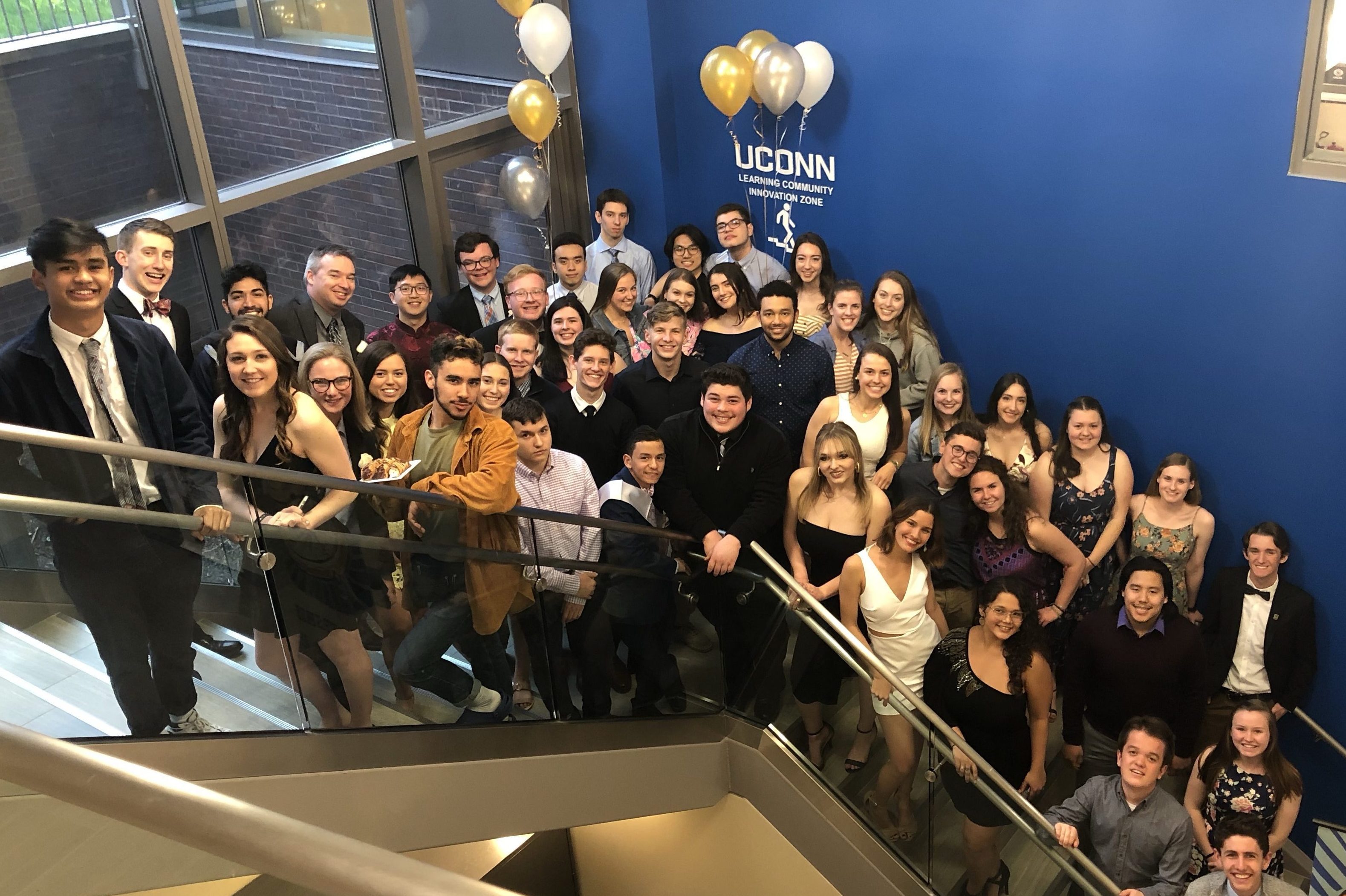 UConn Leadership Learning Community students gather together to pose for a photo at their formal